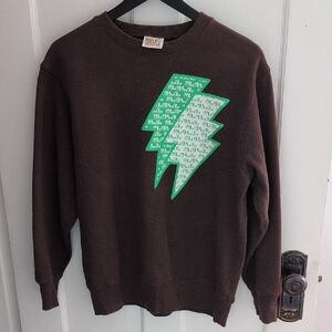 W&LT (Wild And Lethal Trash) Brown Sweatshirt with Green Lightning Bolts.